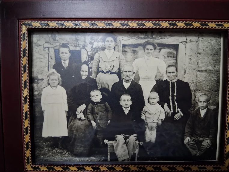 A framed black-and-white family portrait from Croatia, around 1913